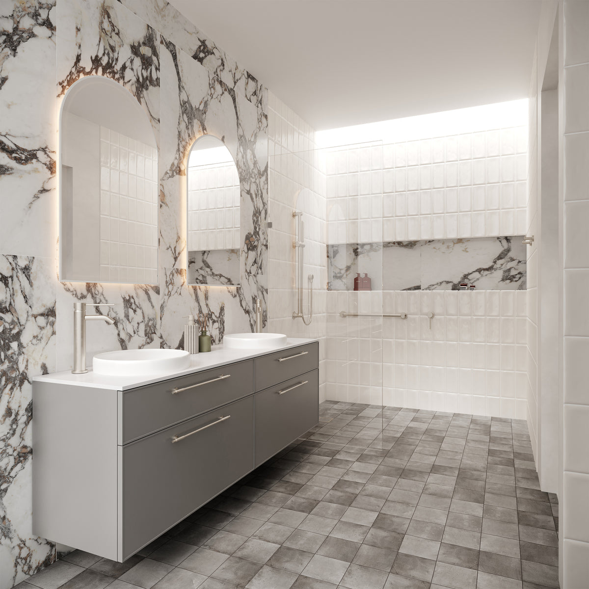 Accessible bathroom featuring marble-look wall tiles, textured white feature tiles, a floating double vanity, vessel basins, grab rails and assisted living accessories within a spacious walk-in shower.