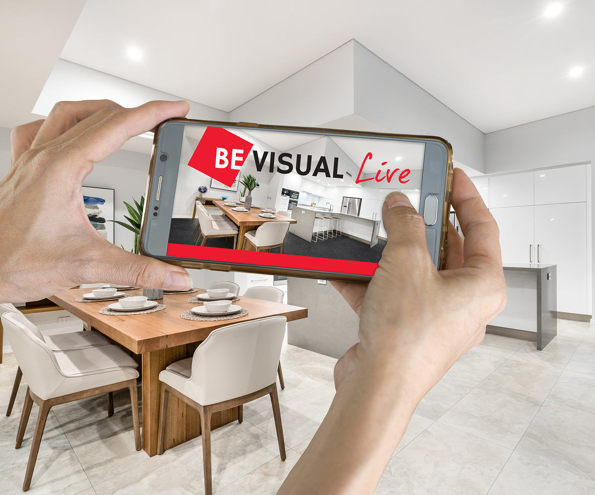 Person using Beaumont Tiles’ BeVisual Live room visualiser on a smartphone to preview tile and flooring selections in a real kitchen space.