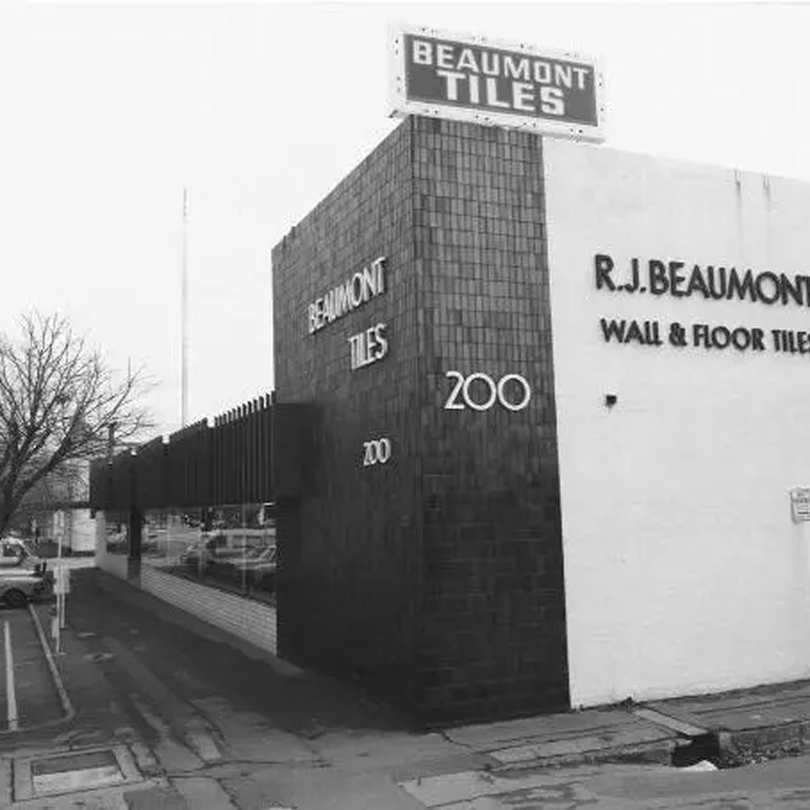 Historic Beaumont Tiles storefront featuring original R.J. Beaumont Wall & Floor Tiles signage on a corner showroom building.