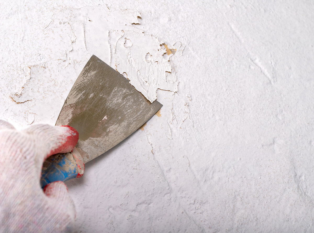Scraping paint from a surface
